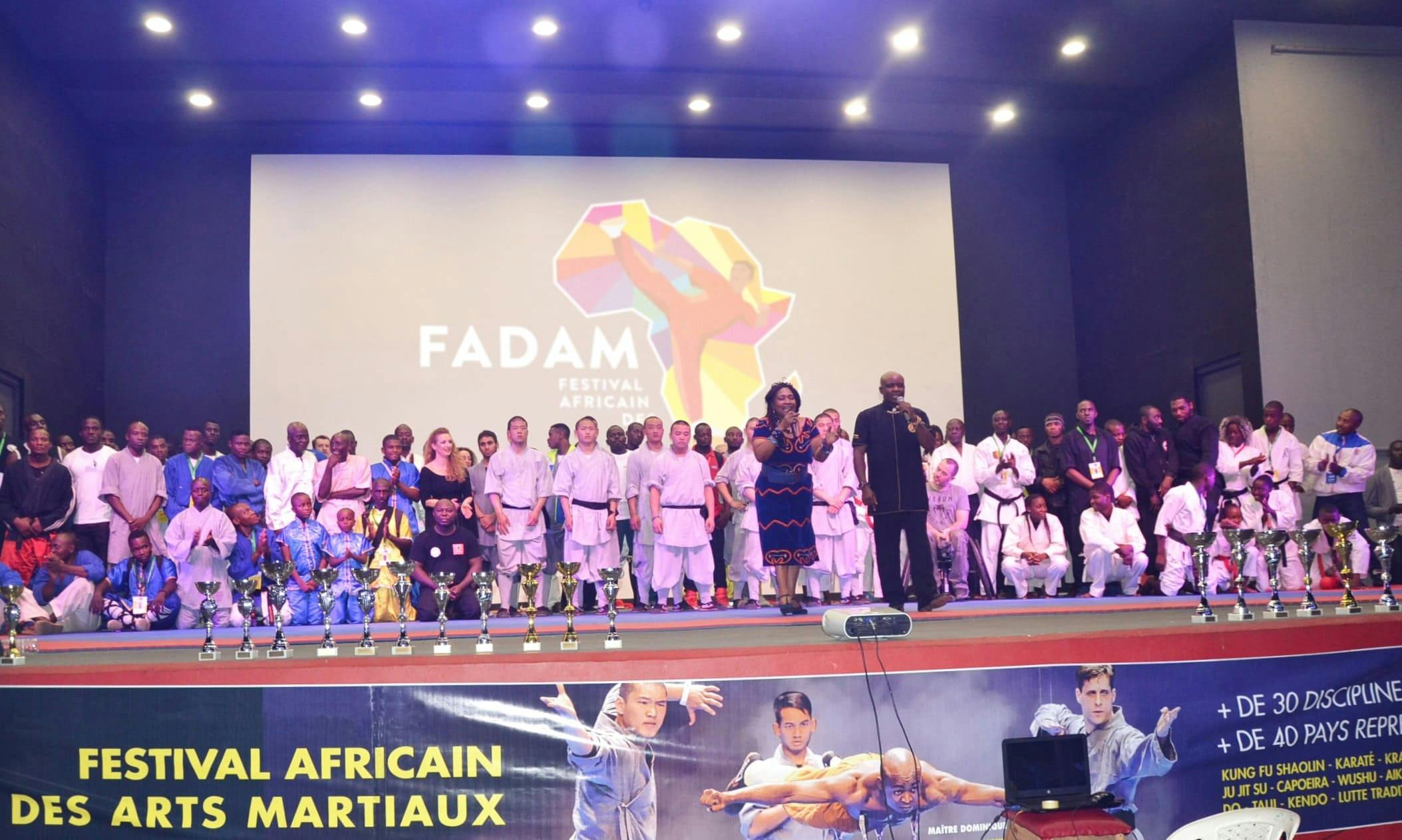 People on stage for a ceremony during FADAM 2018