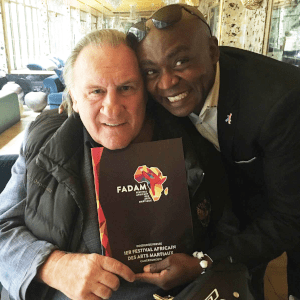 Gérard Depardieu and Dominique Saatenang posing together for a photo